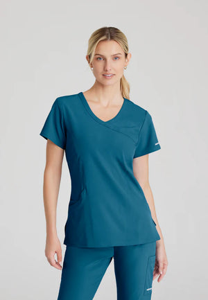 Color: Azul Caribe - vista frontal Camisa Mujer Cuello V Skechers en Medimed Honduras