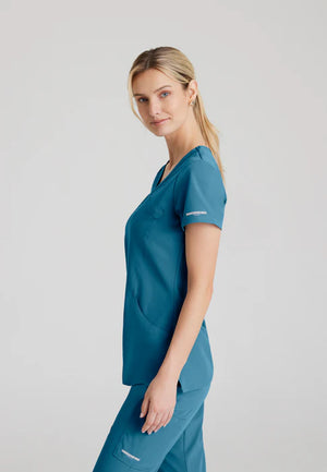 Color: Azul Caribe - vista posterior Camisa Mujer Cuello V Skechers en Medimed Honduras