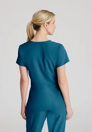 Color: Azul Caribe - detalle Camisa Mujer Cuello V Skechers en Medimed Honduras