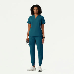Color: Azul Caribe - vista lateral Camisa Jaanuu Calix Fit and Flare en Medimed Honduras
