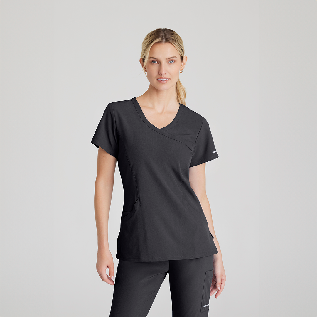 
                  
                    CAMISA DE MUJER  CUELLO V Y 3 BOLSILLOS SKECHERS
                  
                