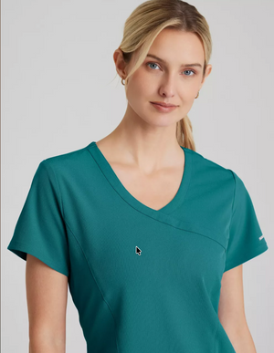 Color: Verde Azulado - vista posterior Camisa Mujer Cuello V Skechers en Medimed Honduras