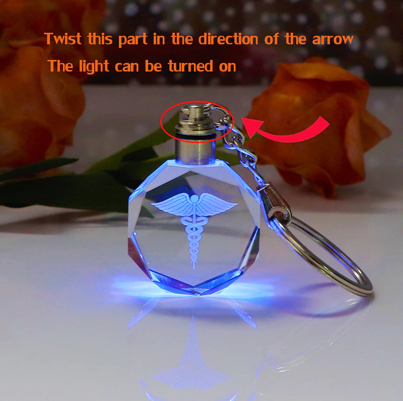 
                  
                    Laser Engraved Crystal Caduceus Keychain with Colorful LED Light
                  
                